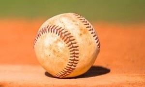 Baseball sitting on playing field
