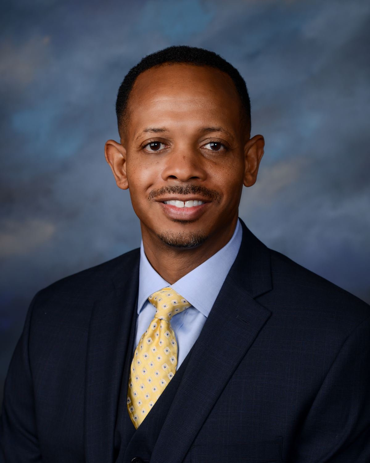 MCBDDS Superintendent Kamarr Gage wearing a suite and tie